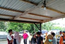 Kapolsek Bambalamotu Pantau Pengecekan Suhu Tubuh Penumpang di Perbatasan.