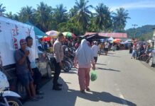 Bhabinkamtibmas Polsek Pasangkayu Amankan Pasar Tradisional Martajaya