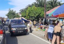 Bhabinkamtibmas Polsek Bambalamotu Amankan Pasar Tradisional Randomayang