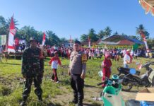 Bhabinkamtibmas Polsek Sarudu Bersama Babinsa Amankan Lomba HUT Kemerdekaan RI ke 79 Di Desa Bulumario