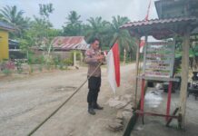 Pemasangan Umbul-Umbul Dan Himbauan Nasionalisme Di Desa Motu Menjelang HUT RI KE-80
