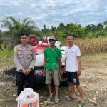 Bhabinkamtibmas Polsek Sarudu Kawal Hasil Panen Jagung Warga ke Gudang Bulog Pasangkayu