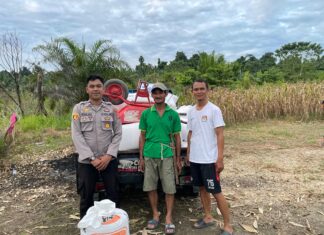 Bhabinkamtibmas Polsek Sarudu Kawal Hasil Panen Jagung Warga ke Gudang Bulog Pasangkayu