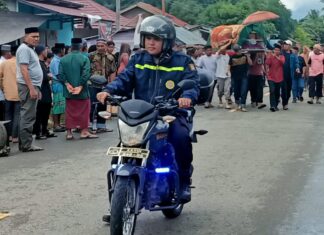 Bhabinkamtibmas Bambalamotu Laksanakan Pengamanan dan Pengawalan Jenazah di Desa Randomayang