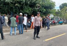 Bhabinkamtibmas Polsek Bambalamotu Laksanakan Pengamanan di Rumah Duka Warga Binaan
