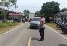 Bhabinkamtibmas Polsek Bambalamotu Laksanakan Pengamanan Pesta Pernikahan Warga di Desa Randomayang