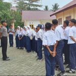 Cegah Kenakalan Remaja, Bhabinkamtibmas Sambangi SMPN 1 Bambalamotu dan Beri Edukasi Kamtibmas