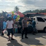 Bhabinkamtibmas Bambalamotu Sigap Amankan Pasar Tradisional, Lalu Lintas Lancar dan Warga Nyaman