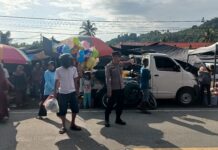 Bhabinkamtibmas Bambalamotu Sigap Amankan Pasar Tradisional, Lalu Lintas Lancar dan Warga Nyaman