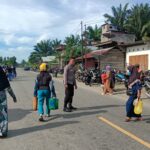 Bhabinkamtibmas Amankan Pasar Tradisional dan Atur Lalu Lintas, Warga Merasa Lebih Nyaman Beraktivitas
