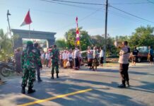 Bhabinkamtibmas Polsek Pasangkayu Kawal Prosesi Ngaben, Wujud Kehadiran Polri di Tengah Masyarakat