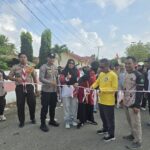 Bhabinkamtibmas Polsek Bambalamotu Amankan Jalan Sehat dan Senam dalam Rangka HUT Pramuka Ke-65 di Kecamatan Sarjo