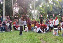 Semarak HUT RI ke-81, Bhabinkamtibmas Bambalamotu Pastikan Perlombaan Warga Aman dan Kondusif